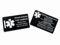 Two black medical ID cards with white text and symbols on a white background