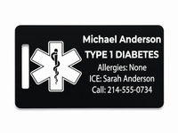 Black medical ID tag with white text and symbol on a white background