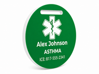 Green medical alert tag with white text and symbol on a white background