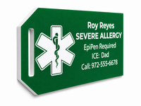 Green medical alert tag with star of life symbol and personalized information on a white background