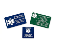 Three medical alert badges with different colors and text on a white background