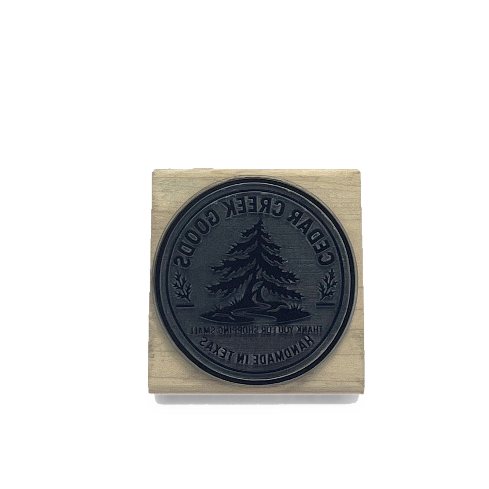 Laser-engraved die face of a custom round box stamp
