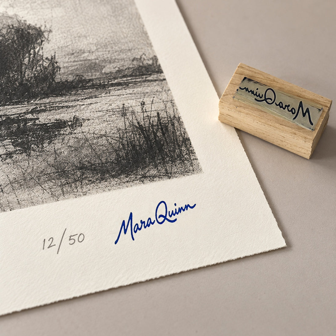 Mara Quinn signature stamped on the signature line of a limited-edition print, numbered 12/50, with the maple stamp beside it
