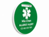 Green allergy alert tag with white text and symbol on a white background