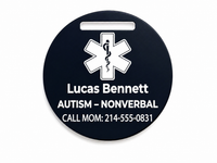 Black round medical alert tag with white text and symbol on a white background