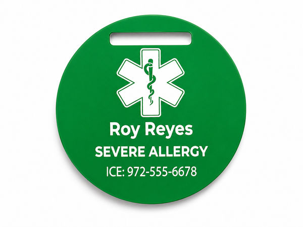 Green medical alert tag with a star of life symbol and personalized text on a white background