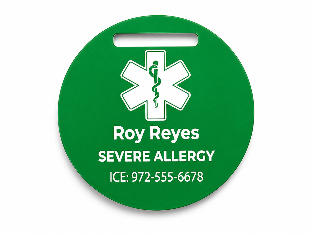 Green medical alert tag with a star of life symbol and personalized text on a white background