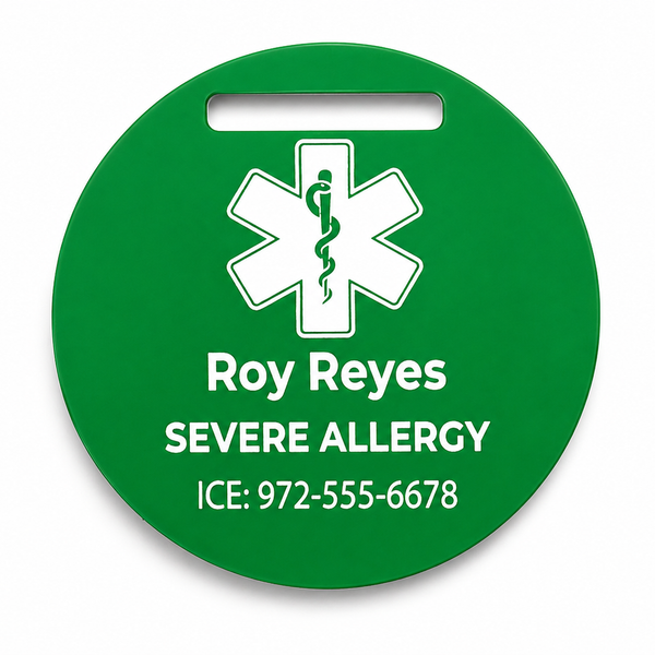 Green medical alert tag with a star of life symbol and personalized text on a white background