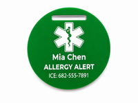 Green allergy alert tag with a white medical symbol on a white background